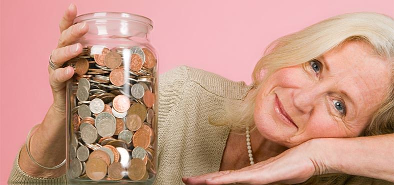 Woman holding a jar of coins