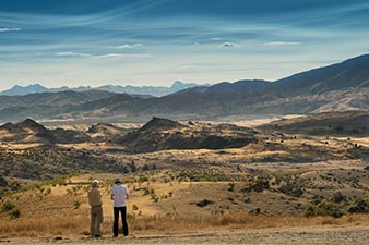 Two farmers looking out across the parched High Country