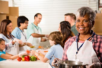 Woman volunteering in a soup kitchen