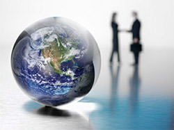 People shaking hands beyond a close-up view of the world