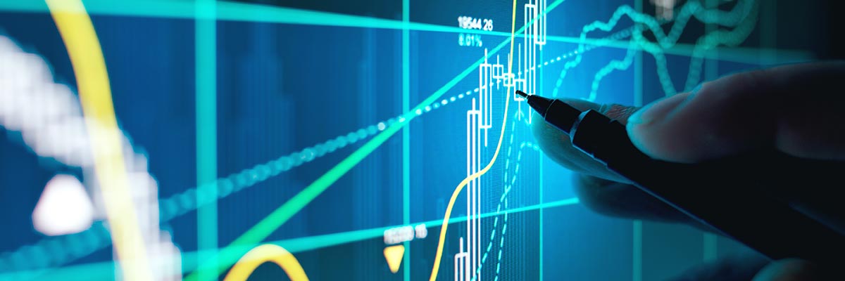 Person tracking share prices on a screen